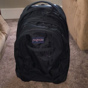 Black Jansport rolling backpack
